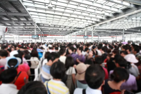 The crowd inside the airport or station