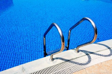 Swimming pool in china hotel with palm trees. china,Sanya clipart