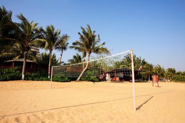 Valleyball net on the beach with great landscape clipart