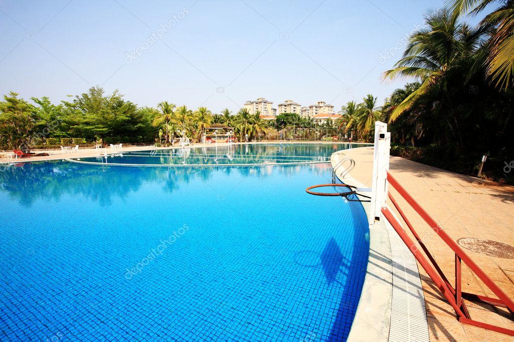 Swimming pool in china hotel with palm trees. china,Sanya Stock Photo ...