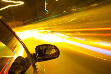 Night traffic,shoot from the window of rush car,motion blur stee clipart