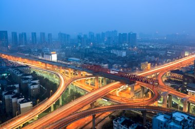 Urban flyover at dusk clipart