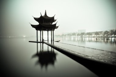 West lake of hangzhou at night clipart