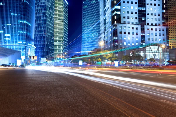 Light trails on the modern city street at night — Stock Photo, Image
