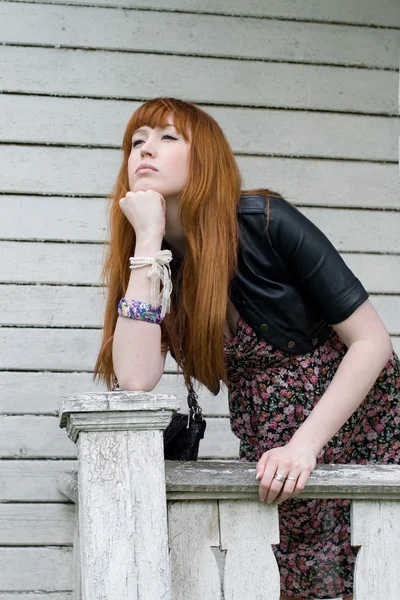 Girl standing on a veranda — Stock Photo, Image