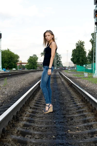 Girl traveling by railroad — Stock Photo, Image