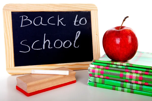 Back to school: blackboard slate and stack of books — Stock Photo, Image