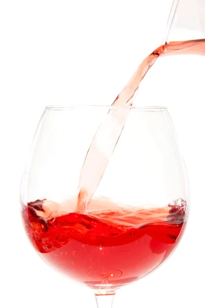 Pouring rose in glass — Stock Photo, Image