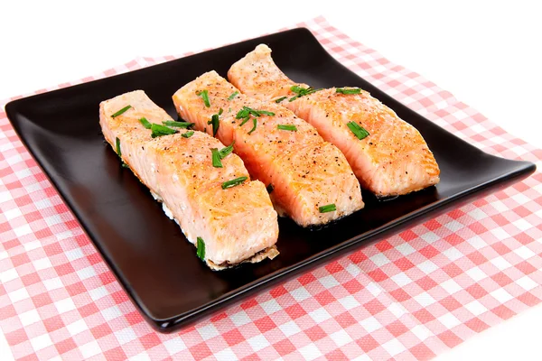 Plate with fresh salmon on checkered napkin — Stock Photo, Image