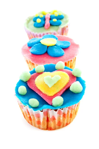 Three cupcakes with marzipan decoration — Stock Photo, Image