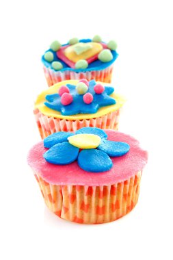 Cupcakes with marzipan decoration clipart