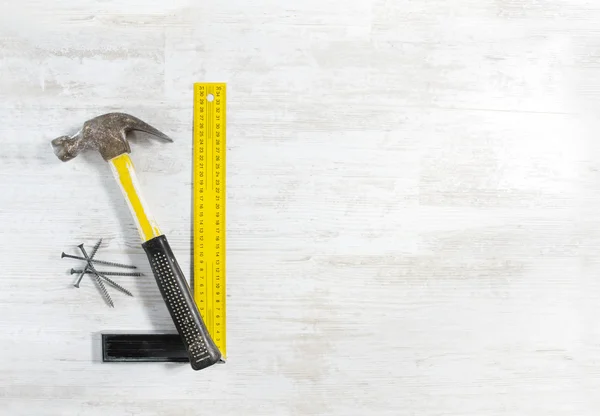 Hammer with nails and ruler — Stock Photo, Image