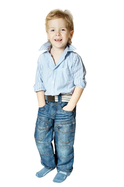 Smiling little boy standing and looking at camera — Stock Photo, Image
