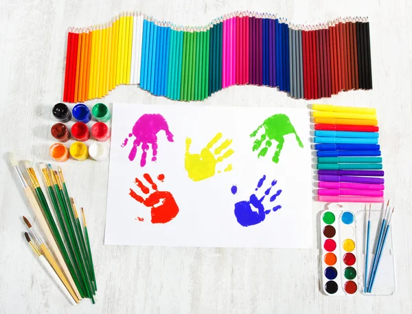 Painting tools set and multicolor child hand prints. Creativity — Stock Photo, Image