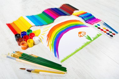 Painting tools set and child drawing picture of rainbow. Creativ clipart