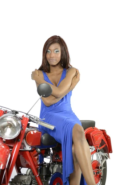Black girl on a red motorbike — Stockfoto