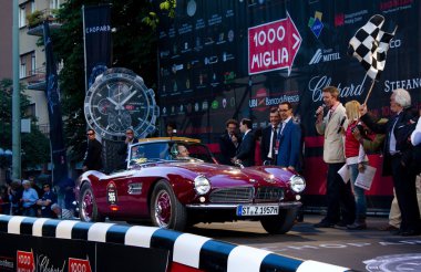 Red 1957 BMW 507 at the start of 2012 1000 Miglia clipart