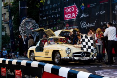 Cream 1955 Mercedes 300 SL W198-I at the start of 2012 1000 Miglia clipart