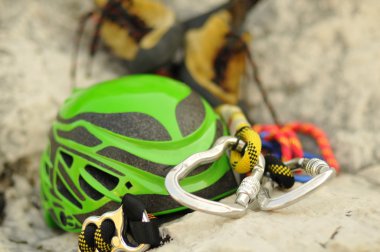 Detail of climbing helmet, carabiner and shoes, focus on carabiner clipart