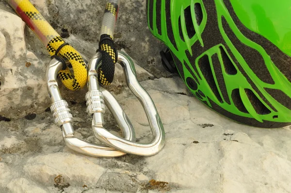 Detail of carabiners with climbing helmet — Stock Photo, Image