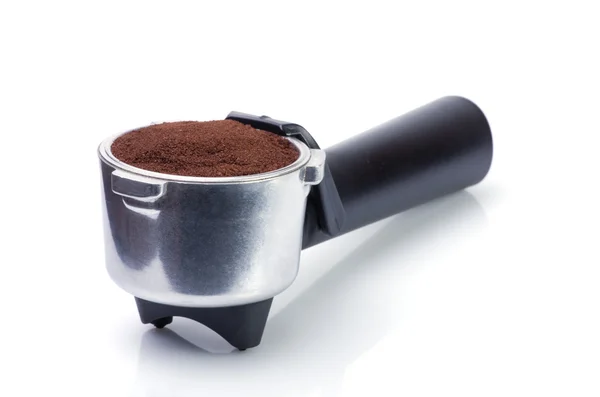 Espressogriff gefüllt mit gemahlenem Kaffee Stockbild