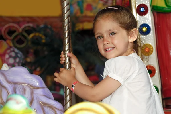 Child in carousel — Stock Photo, Image