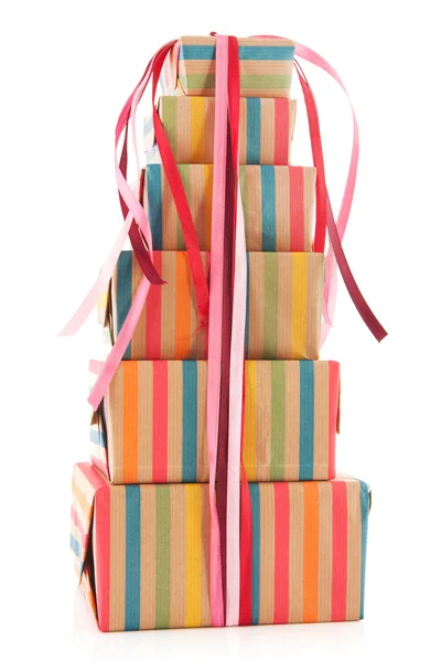 Colorful wrapped presents and flowers — Stockfoto