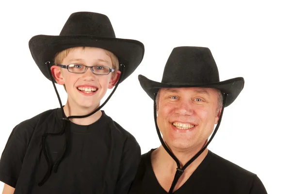 Człowiek i dziecko z kowbojskie kapelusze — Zdjęcie stockowe