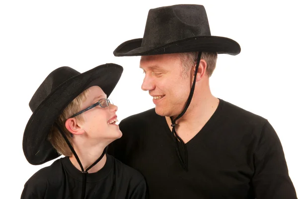 Man och barn med cowboy hattar — Stockfoto