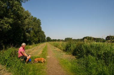 Man with dog in nature clipart