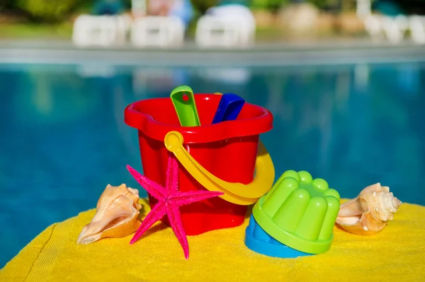 Toys near swimming pool — Stock Photo, Image