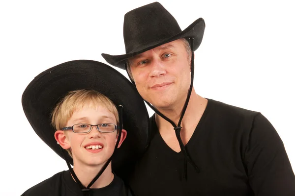 Man and child with cowboy hats — Stock Photo, Image