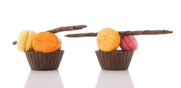 Fresh macaroons in chocolate cups — Stock Photo, Image