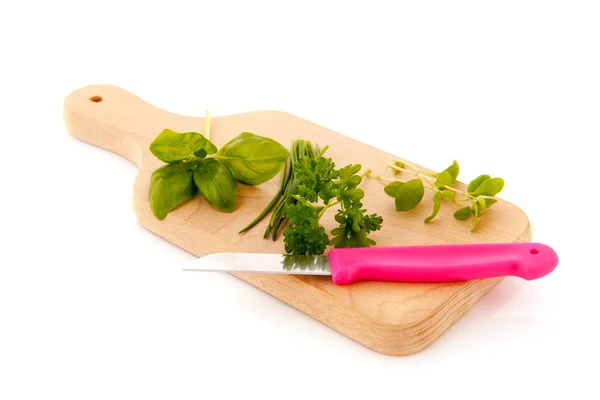 Cutting board with fresh herbs — Stock Photo, Image