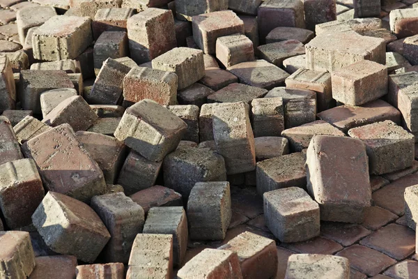 Thrown beige pavement blocks — Stock Photo, Image