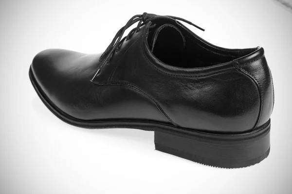 En svart mans sko — Stockfoto