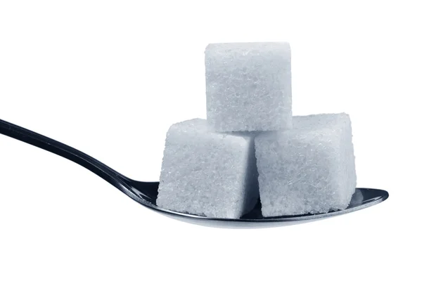 Cucchiaio con cubetti di zucchero — Foto Stock