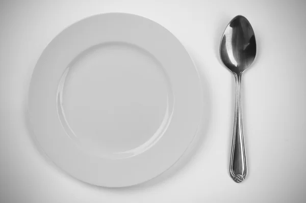 Plate and spoon — Stock Photo, Image