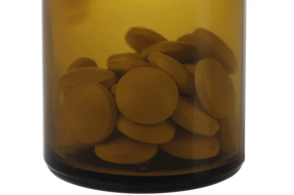 Closed brown jar with pills. — Stock Photo, Image