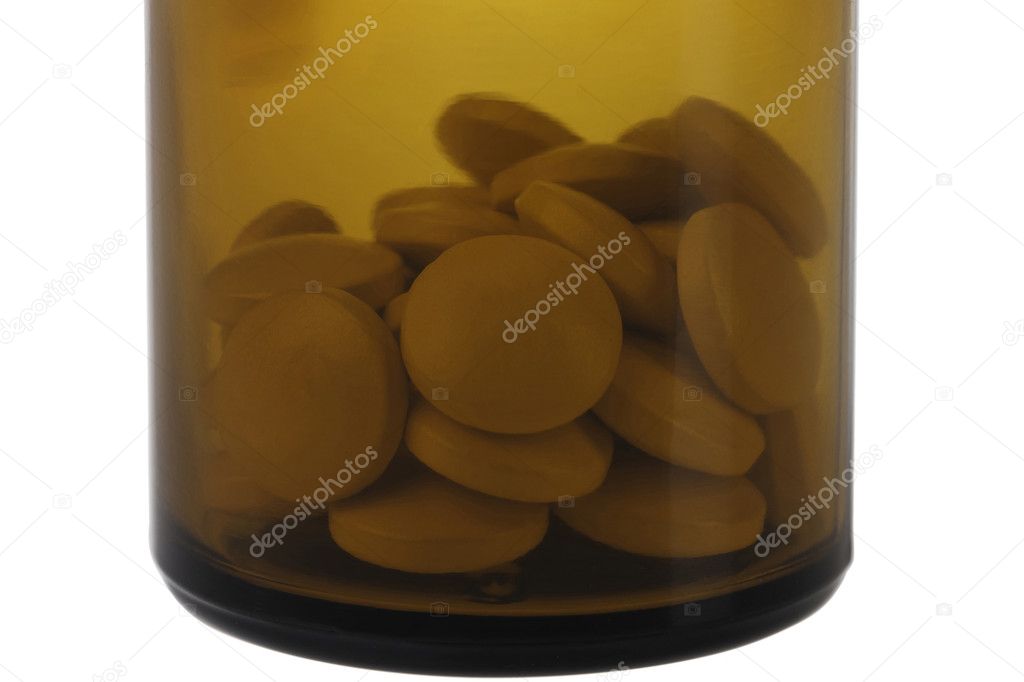 Closed brown jar with pills.