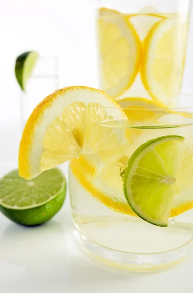 Drinks with lemon and lime — Stock Photo, Image