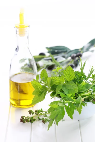 Herbs with olive oil — Stock Photo, Image