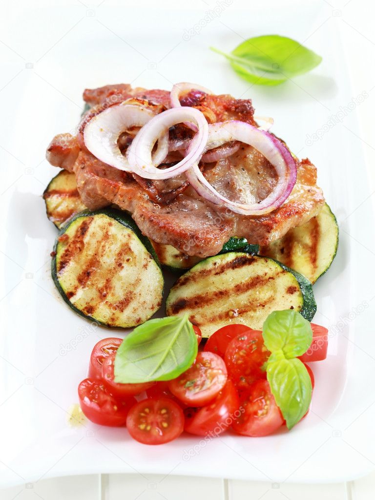 Pan-fried pork steak with grilled vegetable