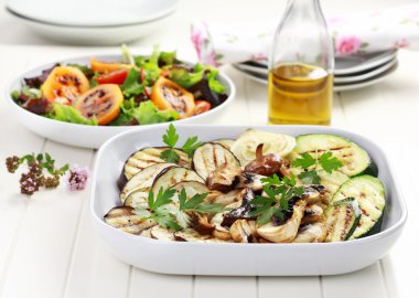 Grilled vegetables and salad with tamarillos clipart