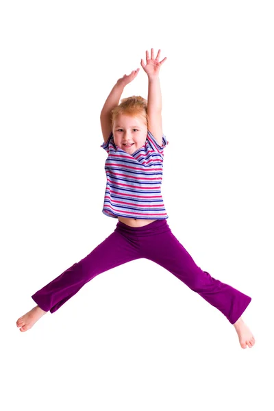 Studio shot of young girl jumping — Stock Photo, Image
