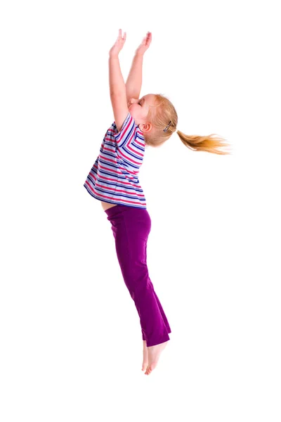 Studio shot van jong meisje springen — Stockfoto