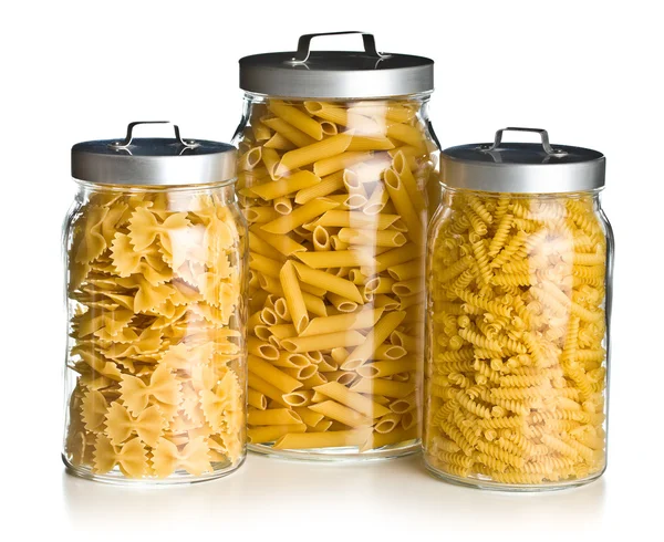 Various raw pasta in glass jar — Stock Photo, Image