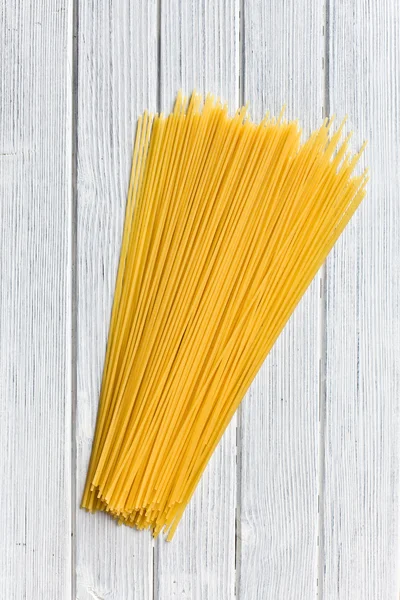Spaghetti on kitchen table — Stock Photo, Image
