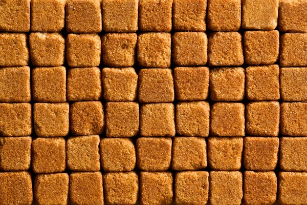 Muster aus braunen Zuckerwürfeln — Stockfoto