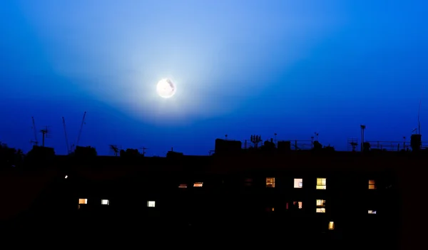Night over London buildings with moon — Stock Photo, Image